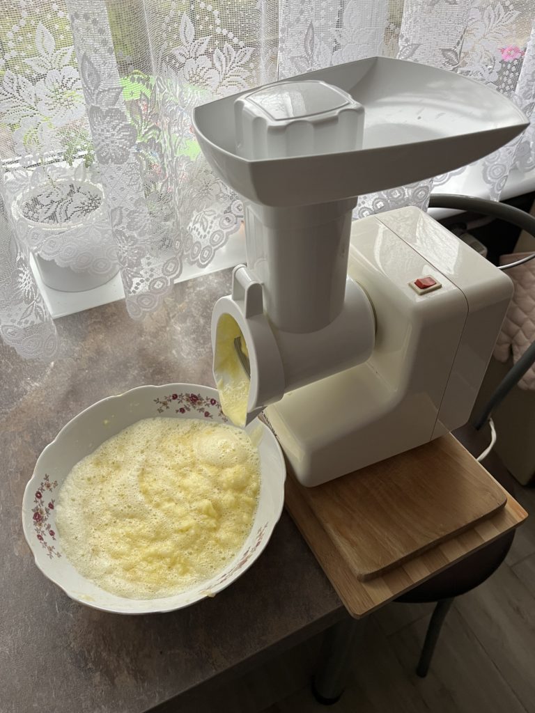 Food processor grinding potatoes