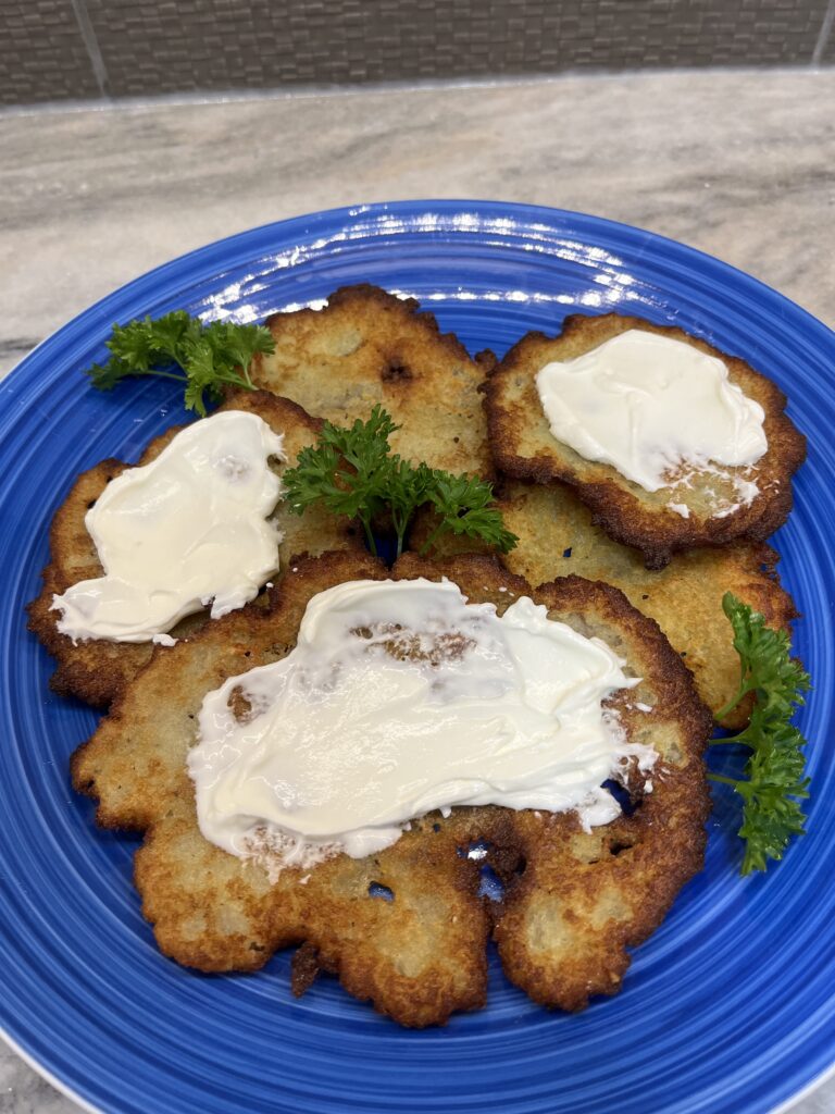 Potato pancakes with sour cream