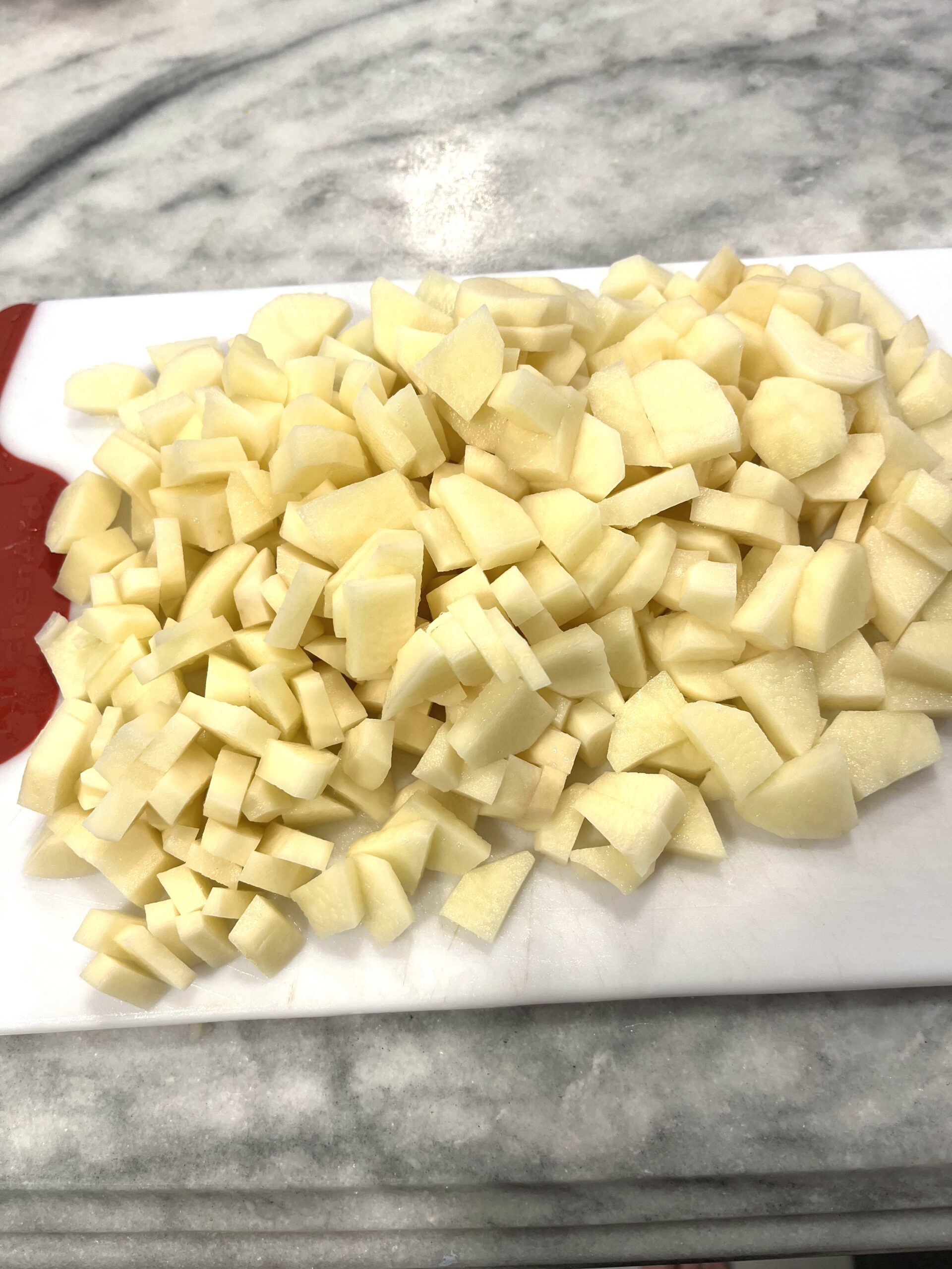 chopped potatoes for Polish Sauerkraut Soup aka Kapusniak