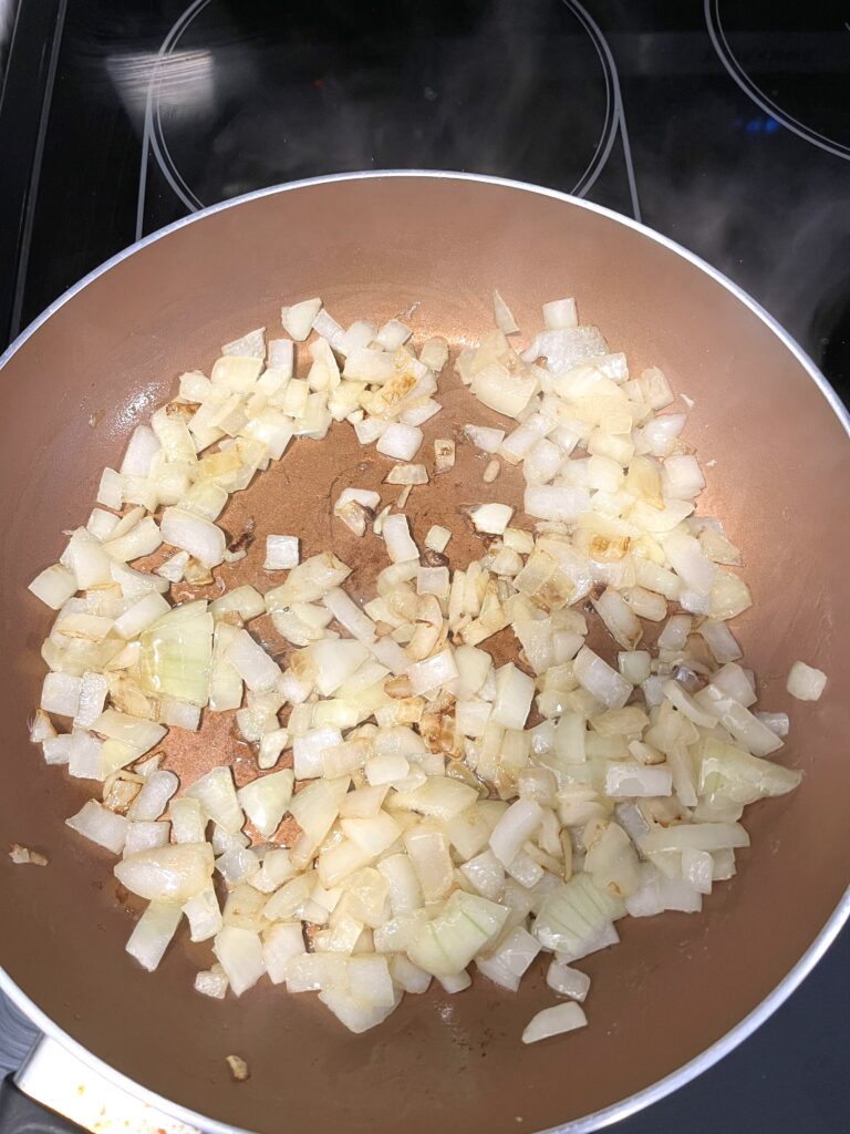 frying onions for Polish Sauerkraut Soup aka Kapusniak