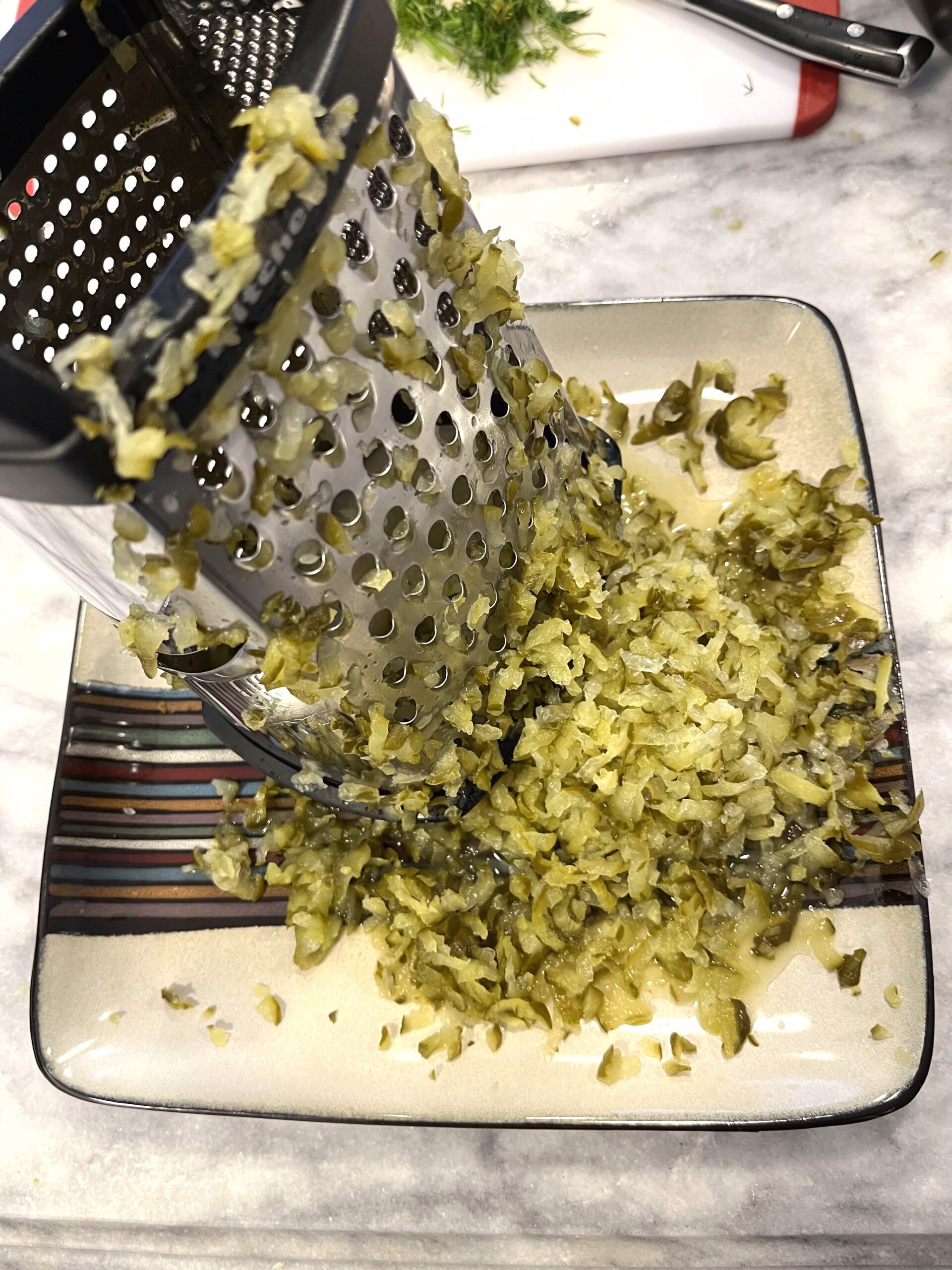 grating pickles for Polish Dill Pickle Soup