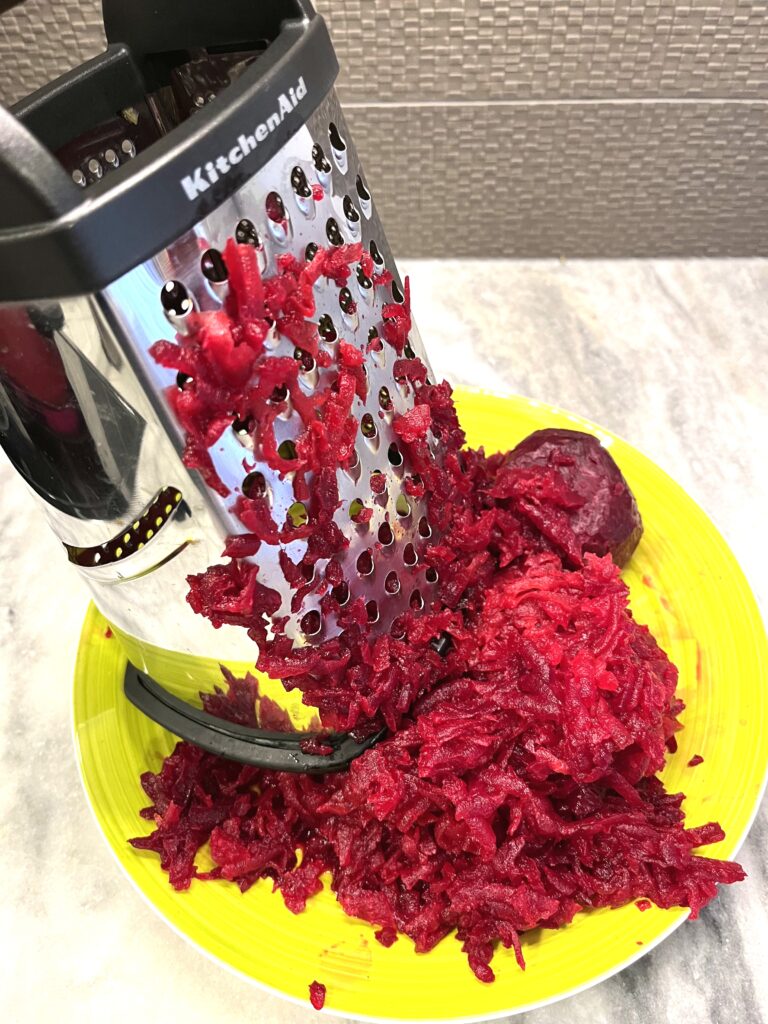 grating beets for Red borscht aka Barszcz czerwony