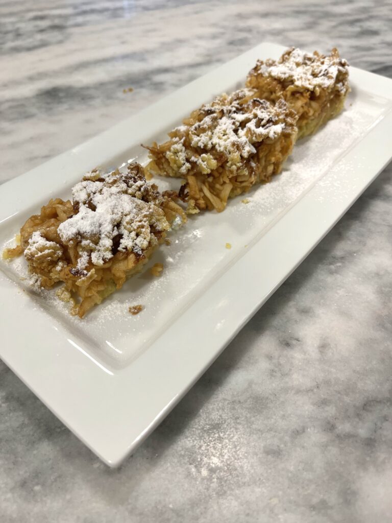 Polish apple pie aka Szarlotka on the plate ready to serve