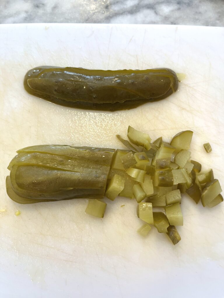 chopped pickles for Polish vegetable salad aka Sałatka