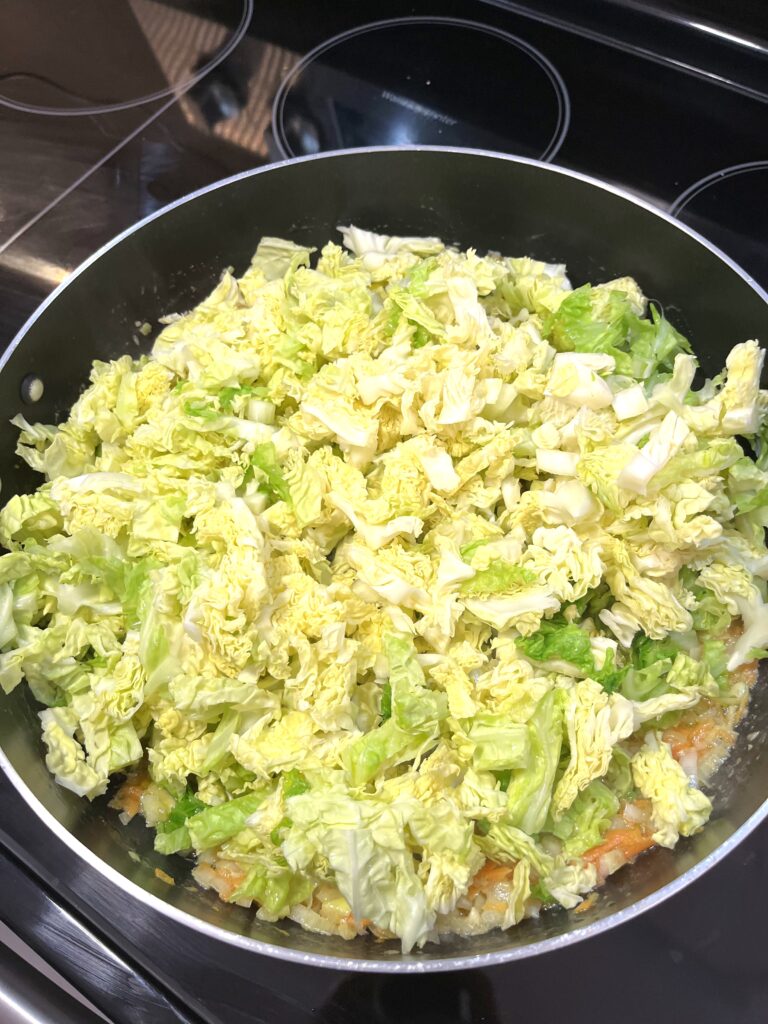 shredded cabbage in the pot for Spring Cabbage aka Młoda Kapusta